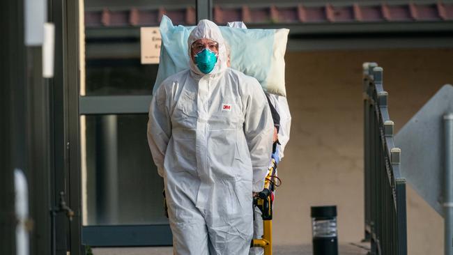 Residents are removed from St Basils aged care home during the Covid outbreak. Picture: Jason Edwards