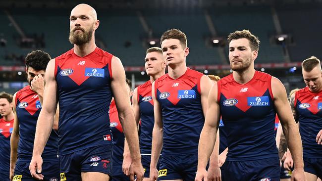 Max Gawn and his Demons teammates look dejected after losing the round 12 AFL match against the Sydney Swans.