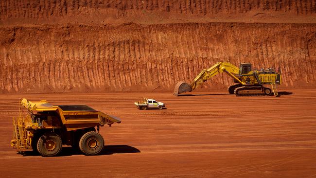 Our falling wages can be blamed, in part, on the drop in price of iron ore. Picture: Ian Waldie/Bloomberg