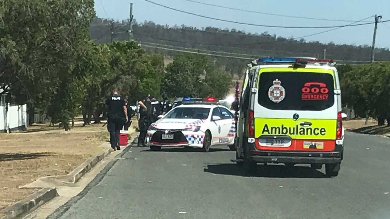 Police blocked off streets as they negotiated for more than an hour with a man at a house at Murgon. Picture: Matt Collins