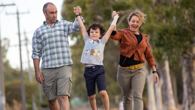 Cancer survivor Luca Boggia-Hall, 8, with mum, Monique Boggia and father Baden Hall. Picture: Jason Edwards