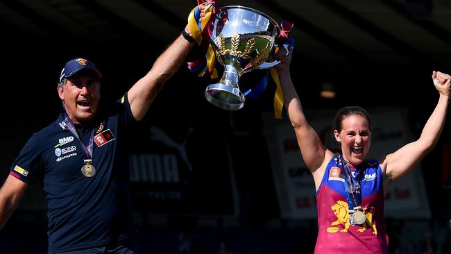 Craig Starcevich and Breanna Koenen hold up the premiership cup following the 2023 AFLW Grand Final. (Photo by Morgan Hancock/AFL Photos/via Getty Images)