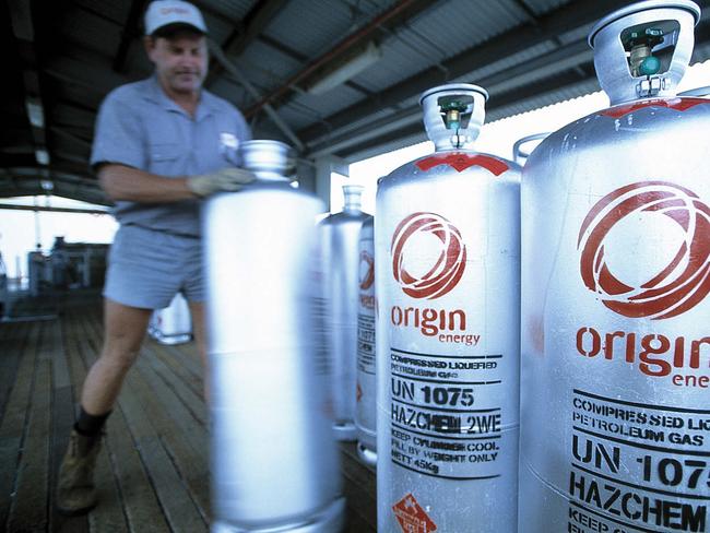 Worker moving bottles of Origin Energy - gas companies Feb 2007