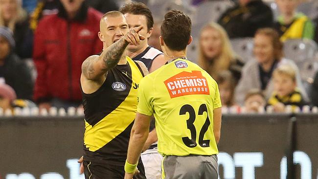 Dustin Martin tells field umpire Jacob Mollison to look at the big screen. Picture: Michael Klein