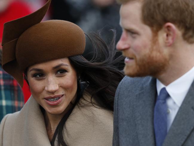 (FILES)  (L-R) US actress and fiancee of Britain's Prince Harry Meghan Markle and Britain's Prince Harry arrive to attend the Royal Family's traditional Christmas Day church service at St Mary Magdalene Church in Sandringham, Norfolk, eastern England, on December 25, 2017. (Photo by Adrian DENNIS / AFP)