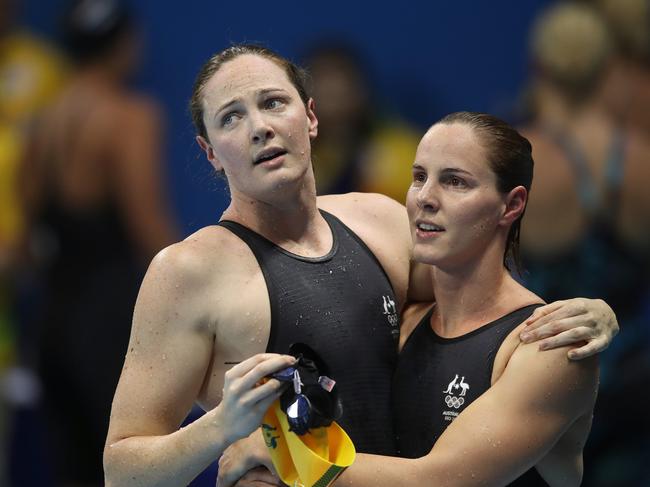 Cate Campbell is embraced by her sister Bronte after finishing sixth in Rio. Picture. Brett Costello