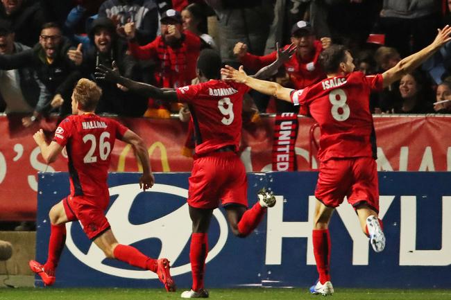 Reds’ hero Ben Halloran celebrates after scoring the winning goal against Melbourne City in the A-League elimination final at Coopers Stadium. Picture: Scott Barbour/Getty