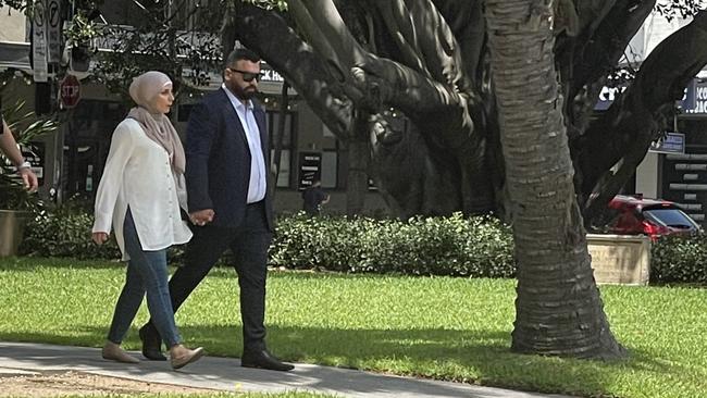 Mohammad Abdulmunim Saleh arrives at court with his wife ahead of sentencing.