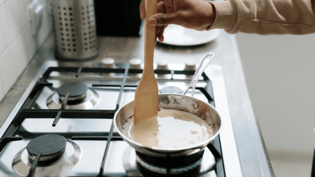 Even if you hate how loud they are, high-efficiency exhaust fans are installed above stoves for a reason. Image: Pexels
