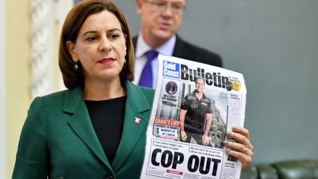 Opposition Leader Deb Frecklington in State Parliament with a copy of The Gold Coast Bulletin and its policing series.  (AAP Image/Darren England)