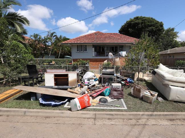 Residents are being urged to leave flood-damaged items outside houses for kerbside collection. Picture: Liam Kidston.