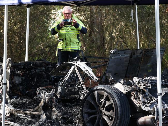 Fire investigators on scene of the burnt out car in Westmeadows. Picture: NCA NewsWire / Ian Currie