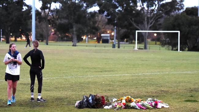 Floral tributes where the young woman’s body was found. Picture: Nicole Garmston