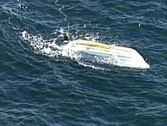 Water operations police will attempt to recover an overturned boat after a fishing trip ended in tragedy off Kangaroo Island. The bodies of two 65-year-old Kingscote men were found and retrieved from the water last night. Picture: 7NEWS