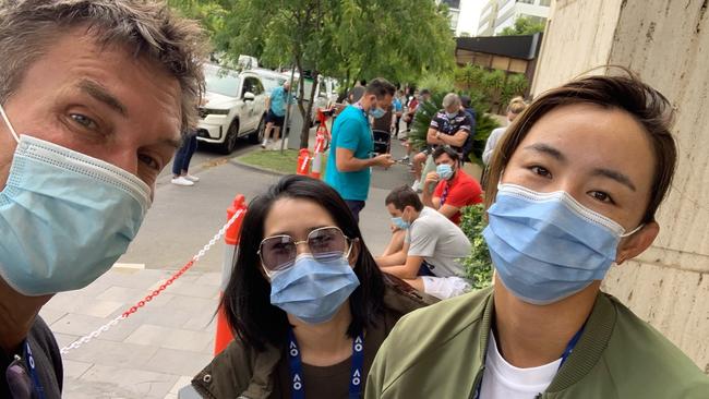 Coach Pat Cash with young tennis star Qiang Wang, right, and her physio Yuning Liao wait for a COVID-19 test at Melbourne’sView Hotel on Thursday