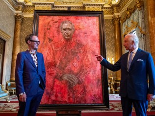 LONDON, ENGLAND - MAY 14: Artist Jonathan Yeo and King Charles III stand in front of the portrait of the King Charles III by artist Jonathan Yeo as it is unveiled in the blue drawing room at Buckingham Palace on May 14, 2024 in London, England. The portrait was commissioned in 2020 to celebrate the then Prince of Wales's 50 years as a member of The Drapers' Company in 2022. The artwork depicts the King wearing the uniform of the Welsh Guards, of which he was made Regimental Colonel in 1975. The canvas size - approximately 8.5 by 6.5 feet when framed - was carefully considered to fit within the architecture of Drapers' Hall and the context of the paintings it will eventually hang alongside. Jonathan Yeo had four sittings with the King, beginning when he was Prince of Wales in June 2021 at Highgrove, and later at Clarence House. The last sitting took place in November 2023 at Clarence House. Yeo also worked from drawings and photographs he took, allowing him to work on the portrait in his London studio between sittings. (Photo by Aaron Chown-WPA Pool/Getty Images)