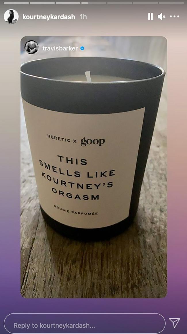 Travis Barker shows off His Goop 'This Smells Like Kourtney's Orgasm' candle.