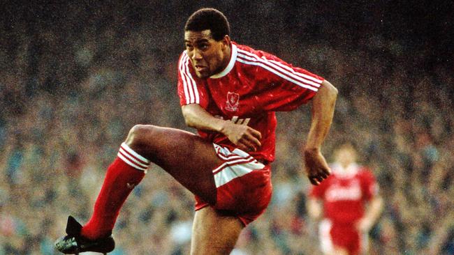 John Barnes lets fly for Liverpool.