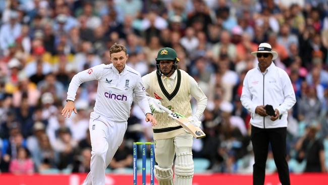 Joe Root of and Usman Khawaja clash during day four of the final test at The Oval.