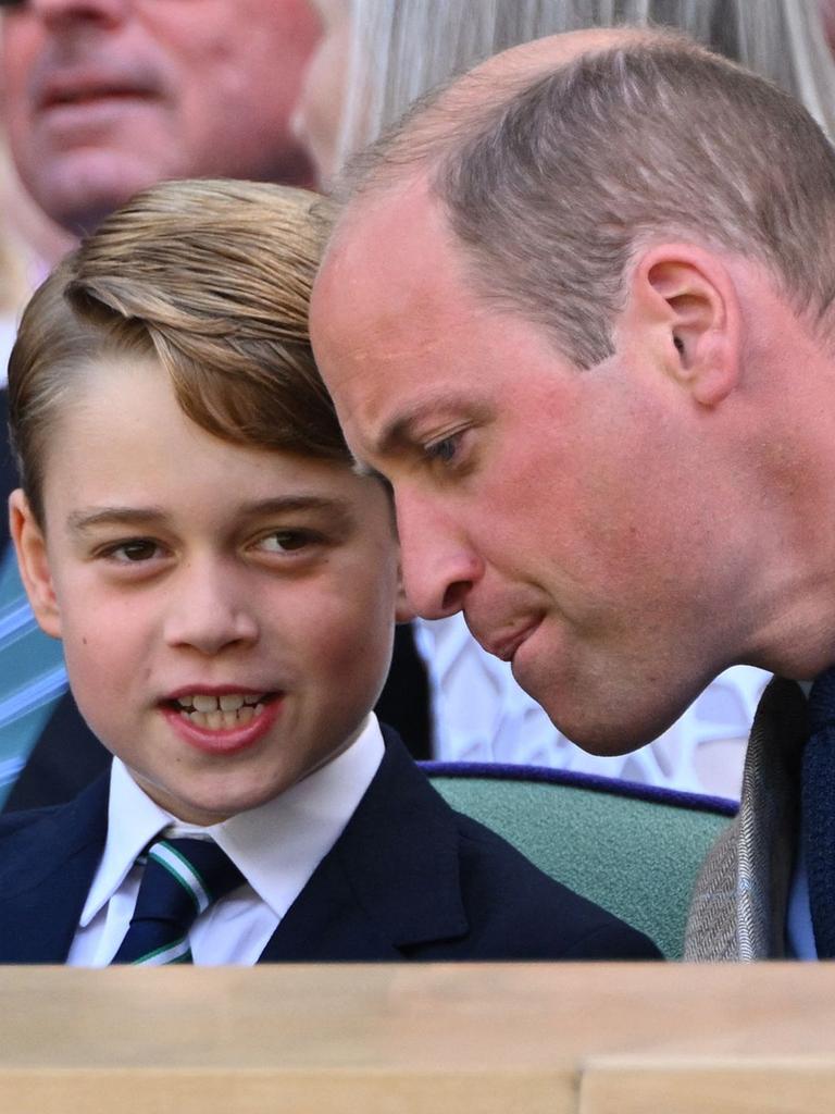 George chatting with his dad during the match. Picture: Sebastien Bozon/AFP