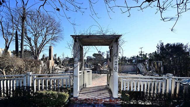 The entrance to a fire-ravaged home destroyed in the Palisades Fire remains standing in Pacific Palisades, Californi. Picture: AFP