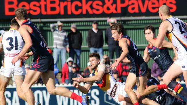 Adelaide's Bryce Gibbs gets a handball away. Picture: AAP Image/Russell Millard