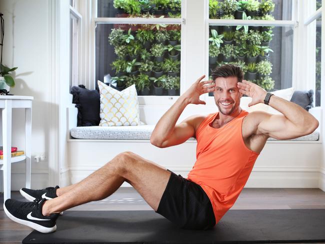 Sam Wood works out at home. Picture: Rebecca Michael.