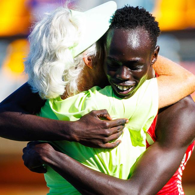Australia's Gout Gout celebrates with his coach Diane Sheppard after winning the men's 200m final.