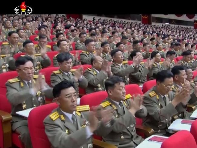 Military officers applaud as North Korean leader Kim Jong Un gives speech at the party congress in Pyongyang. Picture: KRT via AP Video