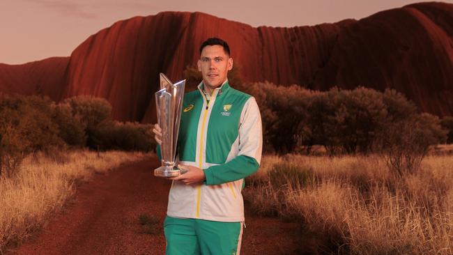 Scott Boland with the T20 World Cup trophy in the shadows of Uluru. Picture: Brook Mitchell/Getty Images