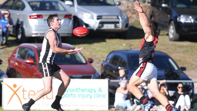 Reynella’s Adam Broadbent, pictured with the ball, was one of the Wineflies’ best in their triumph over Cove at the weekend. Picture: Stephen Laffer