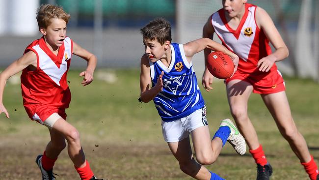 An Airport district player breaks away during a match against North Adelaide in last year’s Sapsasa Metro Football Carnival at West Beach. Picture: Mark Brake