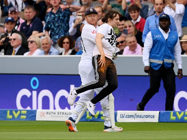 Jonny Bairstow removes a ‘Just Stop Oil’ pitch invader during the second Ashes test match. Picture: Getty