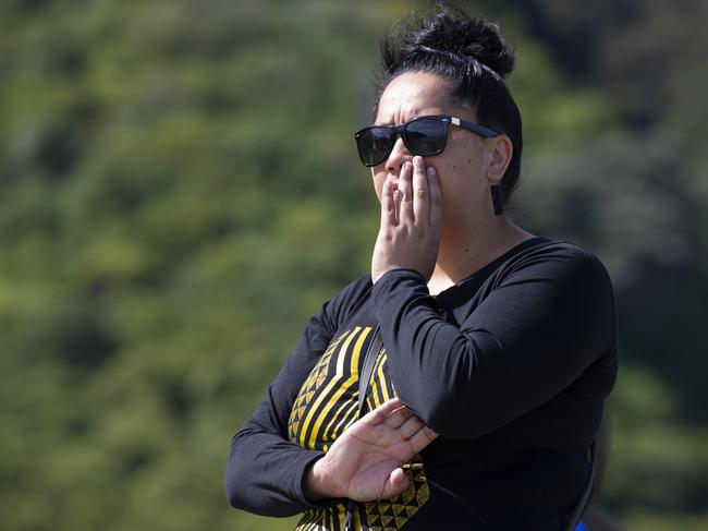 A woman watching the police cordon near the Whakatane wharf, a day after the eruption of White Island. Picture: Brett Phibbs