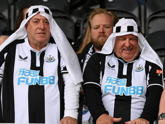 NEWCASTLE UPON TYNE, ENGLAND - OCTOBER 17: Fans of Newcastle United show their support prior to the Premier League match between Newcastle United and Tottenham Hotspur at St. James Park on October 17, 2021 in Newcastle upon Tyne, England. (Photo by Stu Forster/Getty Images)