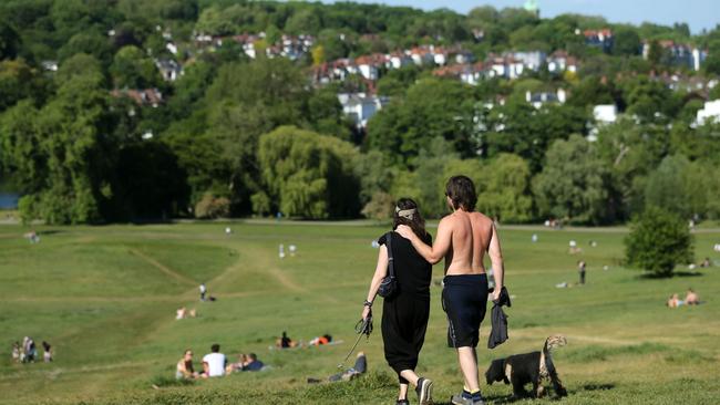 People keep to strict social distancing on Hampstead Heath, north London. Picture: AFP.