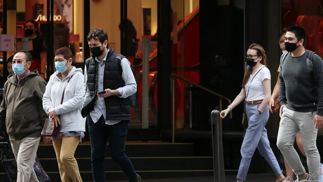 Pedestrians move along George Street in the CBD. Picture: Lisa Maree Williams/Getty Images