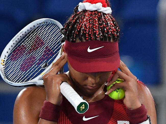 Japan's Naomi Osaka competes against Czech Republic's Marketa Vondrousova during their Tokyo 2020 Olympic Games women's singles third round tennis match at the Ariake Tennis Park in Tokyo on July 27, 2021. (Photo by Tiziana FABI / AFP)