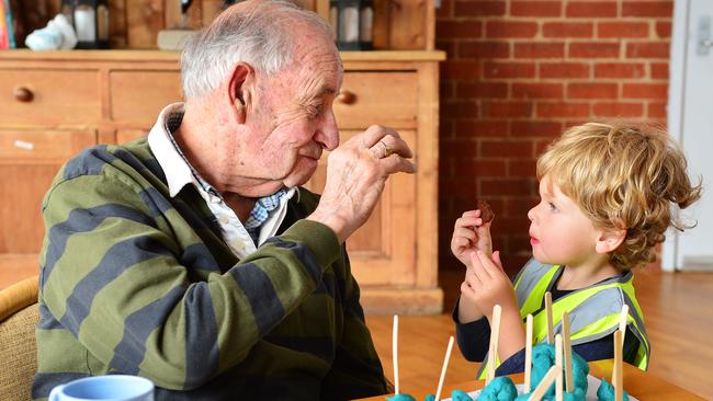 Nursing home resident Bruce Bowman and young Sam enjoy quality time. Picture: Nicki Connolly