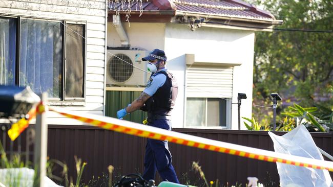 Police outside the Yagoona house today. Picture: Gaye Gerard