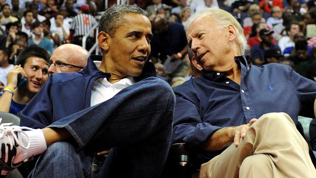 US President Barack Obama and Vice-President Joe Biden watch a US v Brazil basketball game.