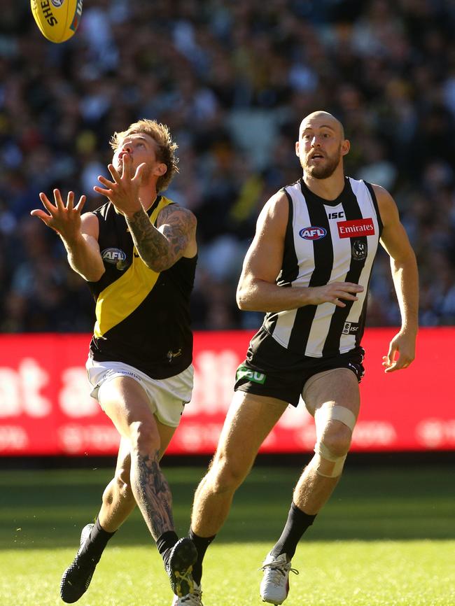 Nathan Broad marks in front of Collingwood’s Ben Reid on Sunday. Picture: AAP Image/Hamish Blair