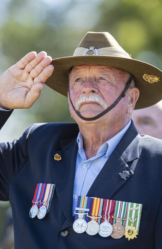 Vietnam veteran Les Hillberg salutes during the playing of the national anthems at Toowoomba's Anzac Day mid-morning service at the Mothers' Memorial, Thursday, April 25, 2024. Picture: Kevin Farmer