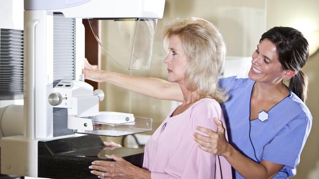 Woman getting a mammogram / breast cancer check.