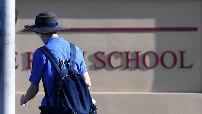 A school student arrives for the first day of face-to-face schooling on Monday. Photo: AAP.