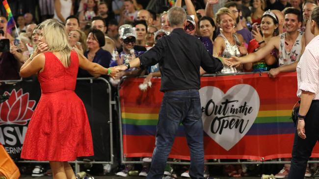 Mardi bums: Bill and Chloe Shorten press the flesh at mardi gras, with not a grasping older, wealthier person in sight. Picture: MEGA