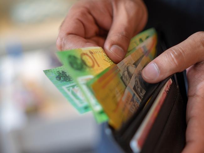 a male taking money out of the valet.  Picture: istock