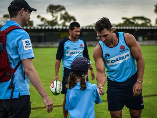 Nick Phipps meets a fan at the new NSW Rugby headquarters. Picture: Jamie Conroy/NSW Rugby