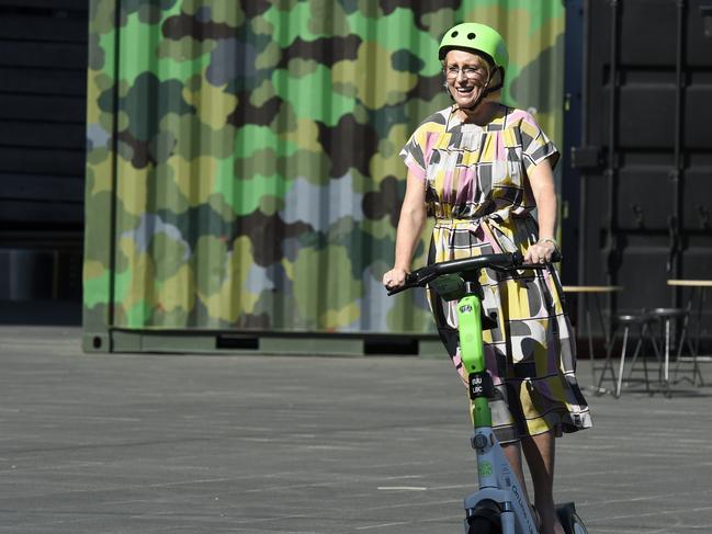 Former lord mayor Sally Capp takes a Lime e-scooter for a ride in 2022. Picture: Andrew Henshaw