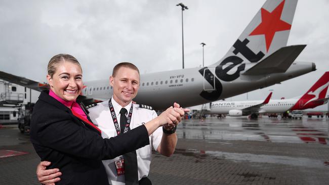 Jetstar captain Rob Williamson and his wife, Qantas Link flight attendant Naomi Williamson, are looking forward to reuniting with family. Picture: Brendan Radke